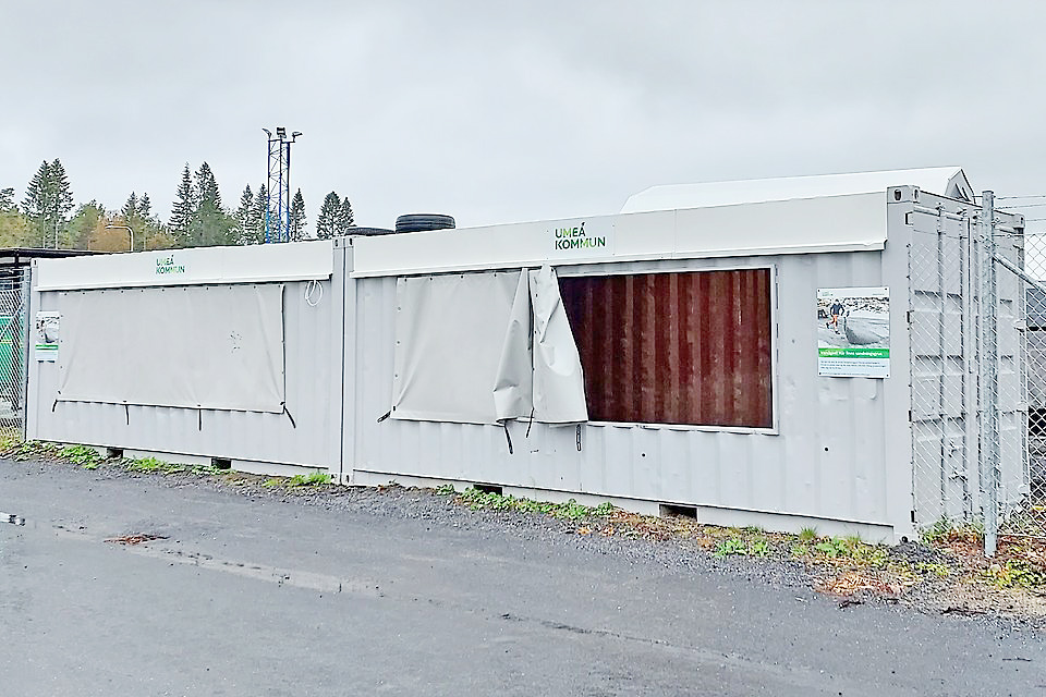 Grå container